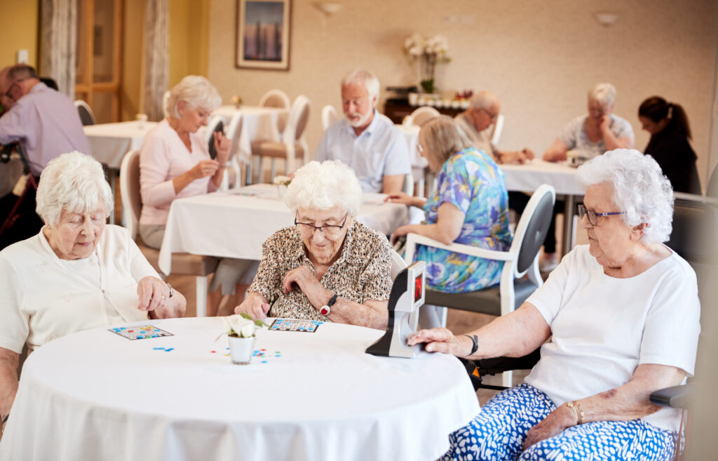 seniors playing bingo in assisted living facility