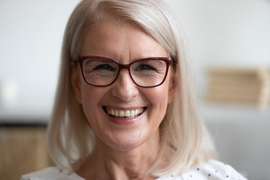 senior woman with dental and vision coverage
