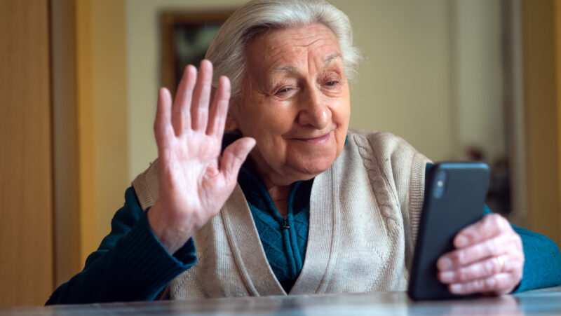 senior woman communicating on phone