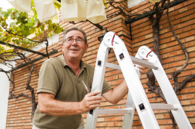 senior man on ladder
