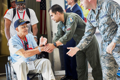 military veteran greeted by fellow soldiers
