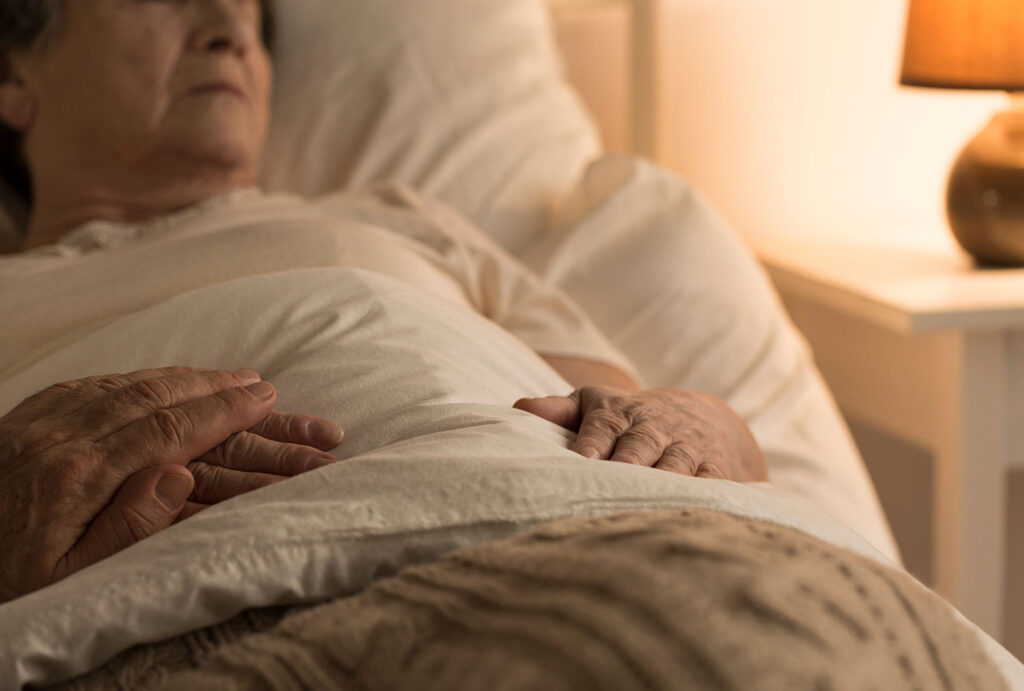 senior elderly woman in bed