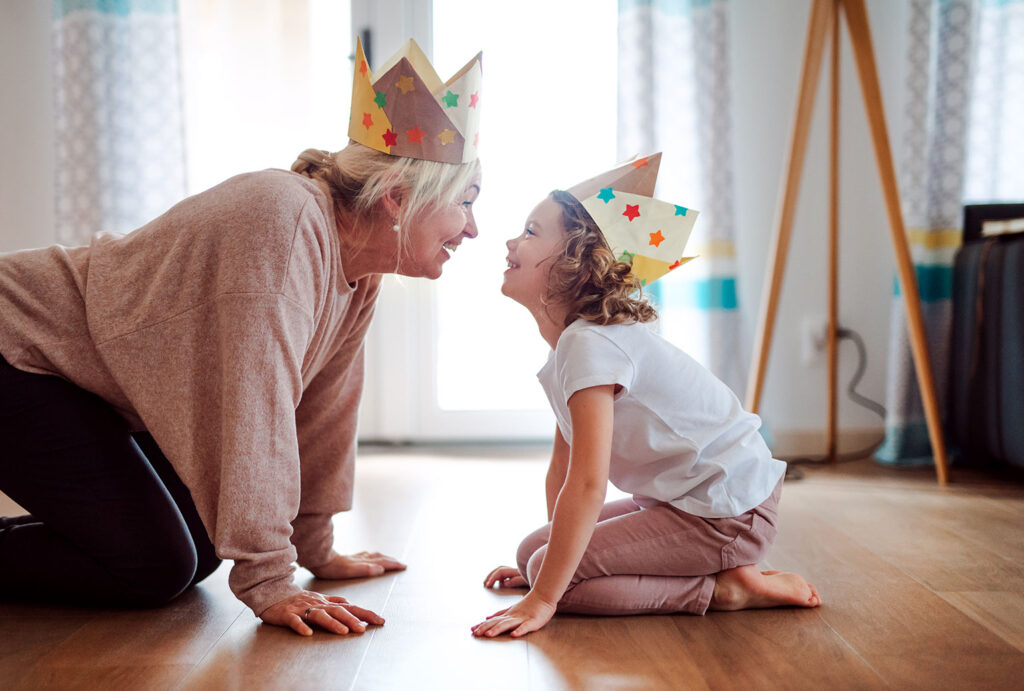 Grandma and granddaughter wearing home-made crowns