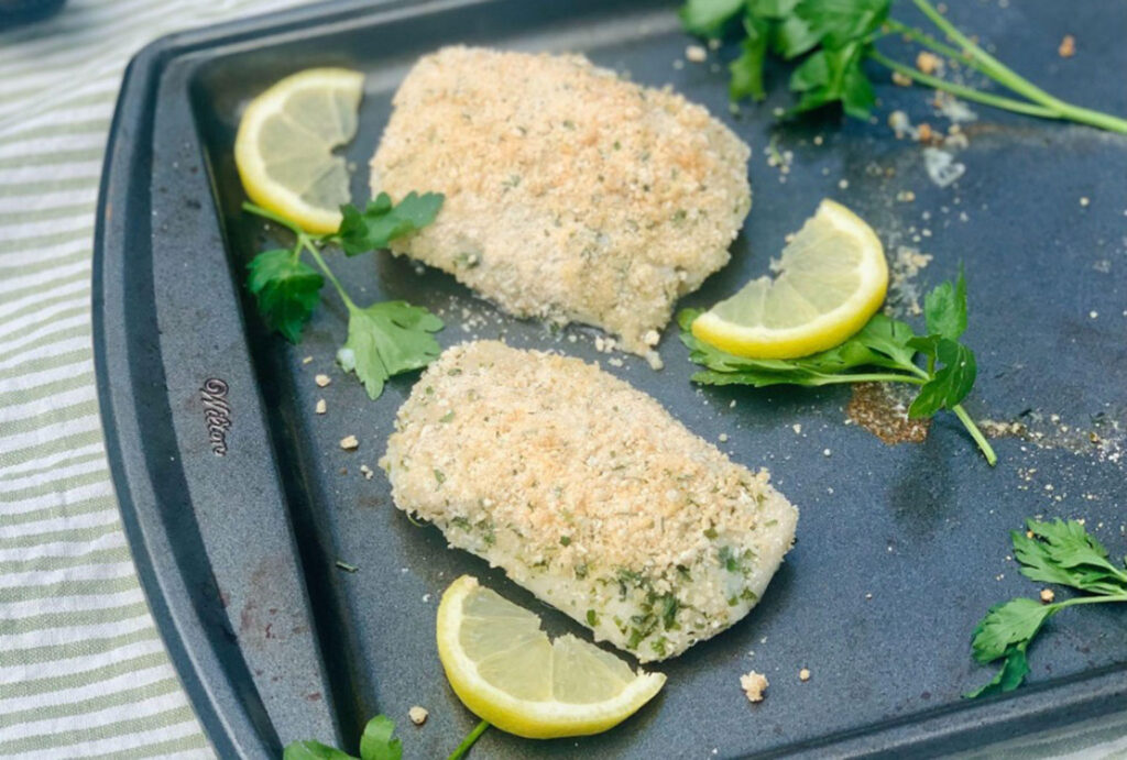 cod and lemon slices on a pan
