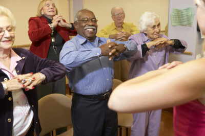 group of older people stretching
