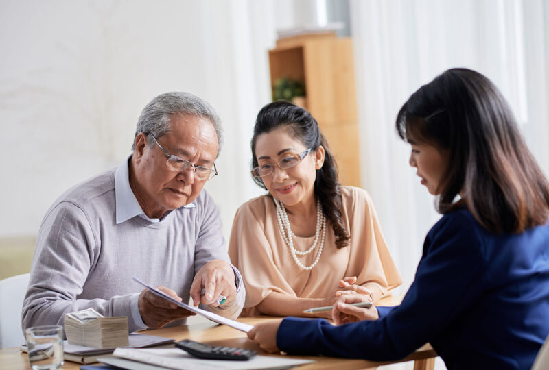 older couple meeting with an attorney