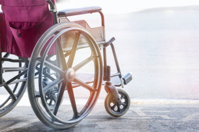 wheelchair parked on handicap symbol