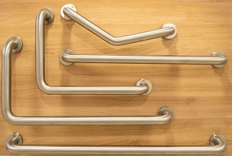 different types of grab bars with wood background