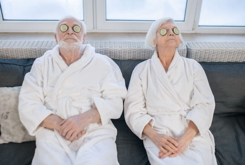 senior couple in robes at a spa