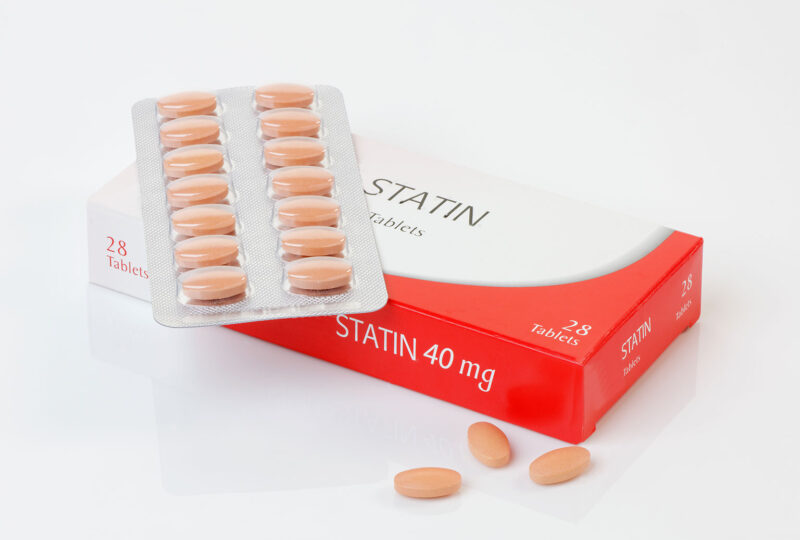 pills and a box that says statins