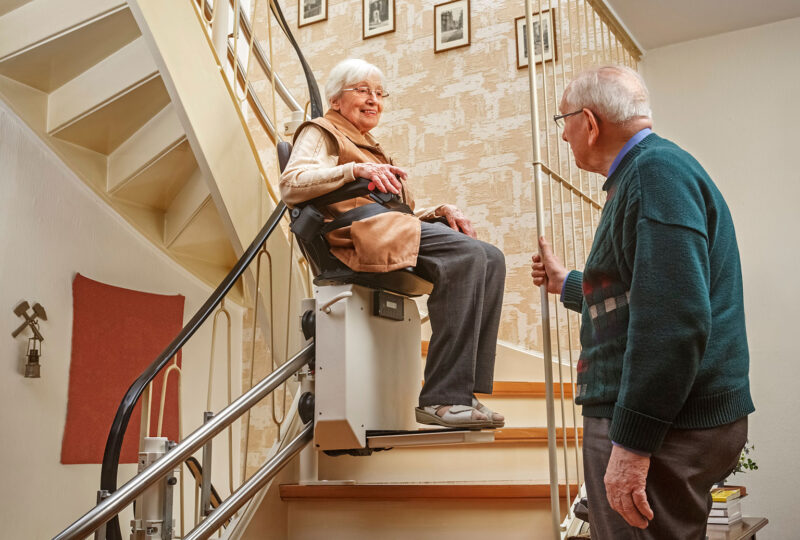 senior Couple in the Staircase with Stairlift