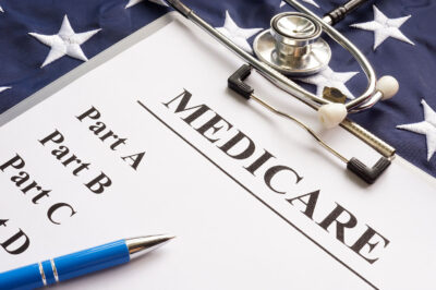 Medicare papers with different parts and flag.