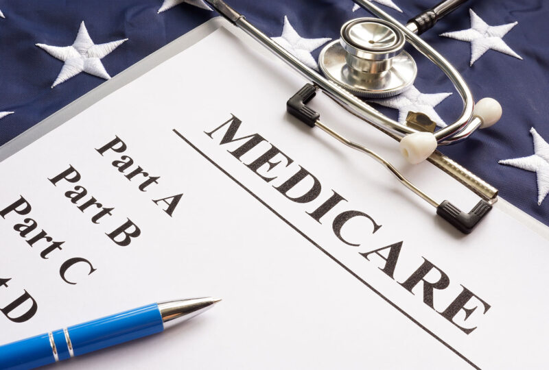 Medicare papers with different parts and flag.