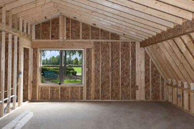 Room addition construction with pitched ceiling and garden view window